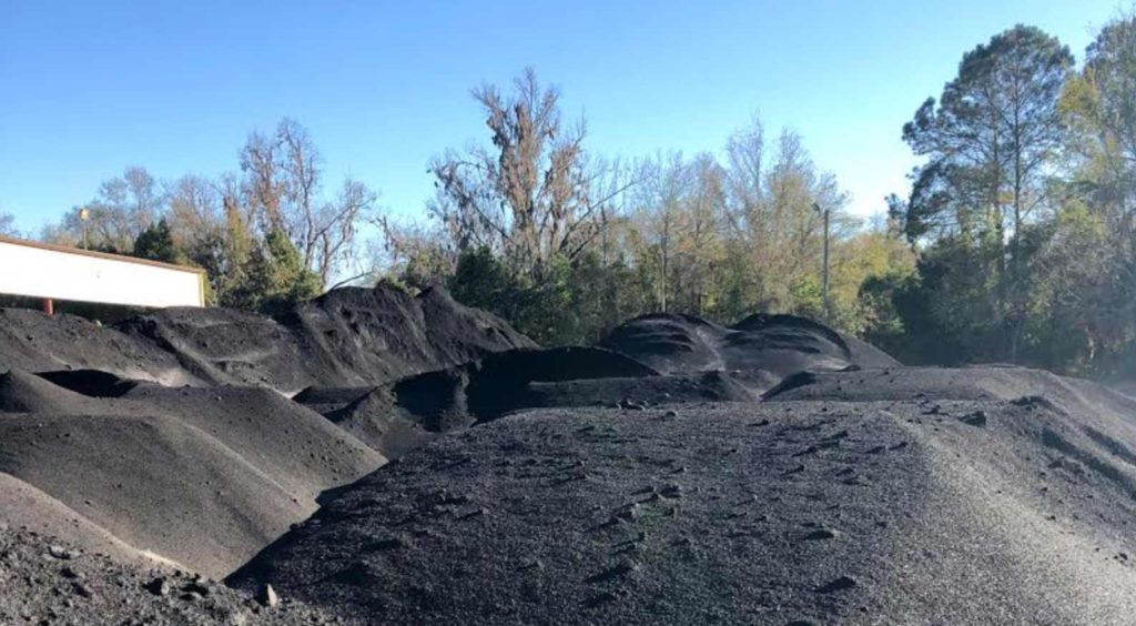 Large Piles Of Biochar From Mill Waste